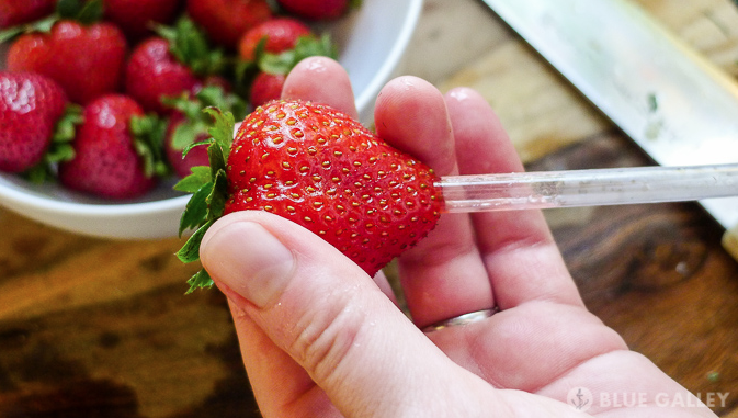 hull strawberry with straw